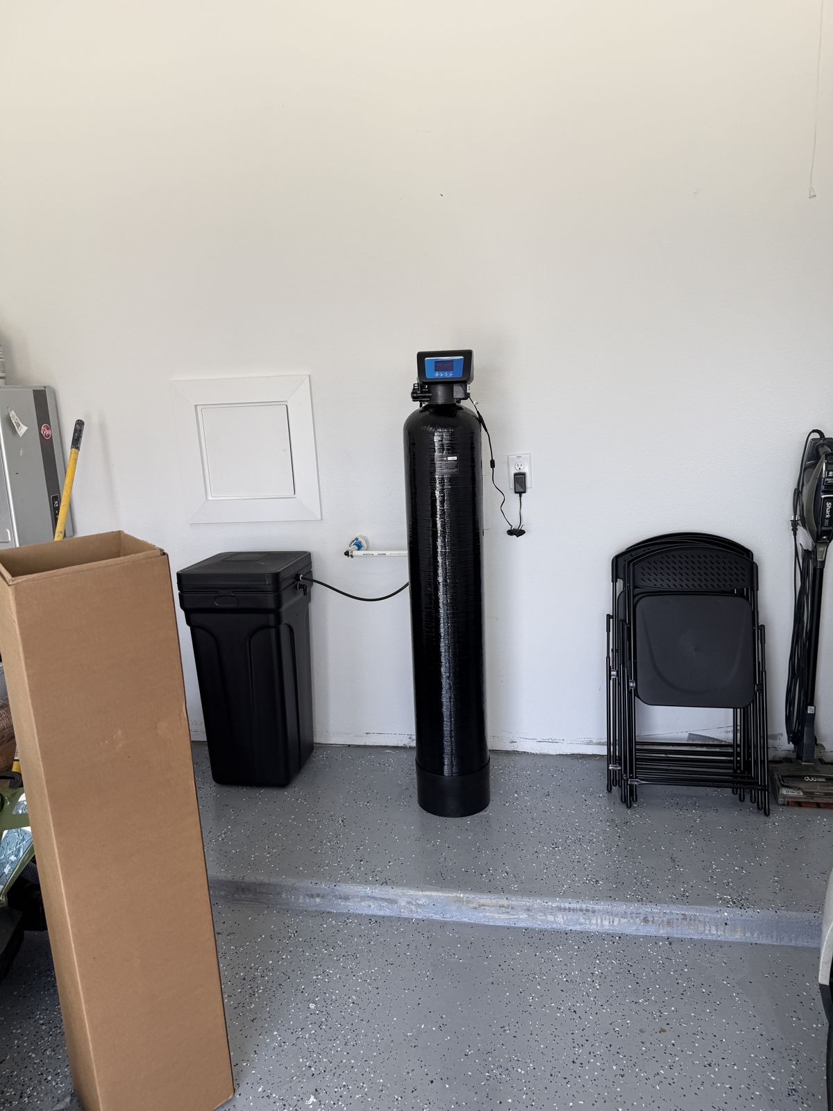 Water softener and brine tank installed by H2Ome in a North Texas garage