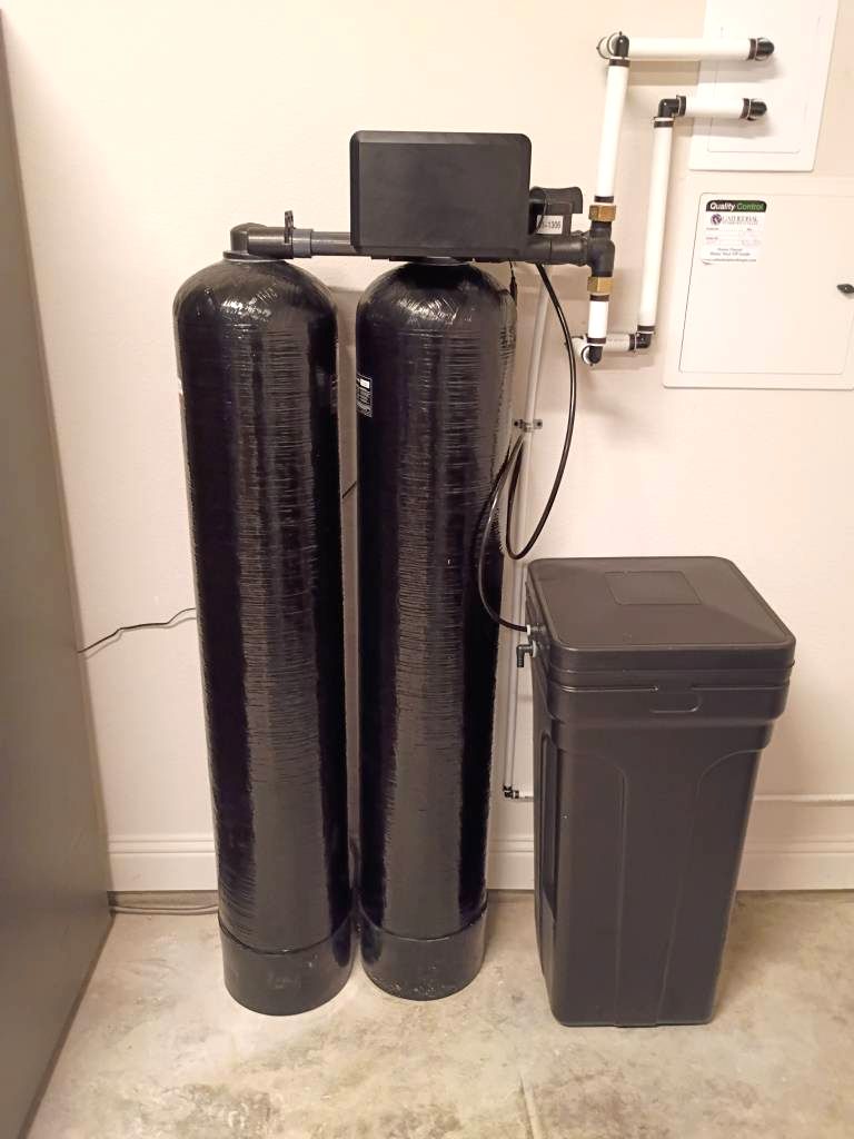 Twin-tank water treatment system installed by H2Ome